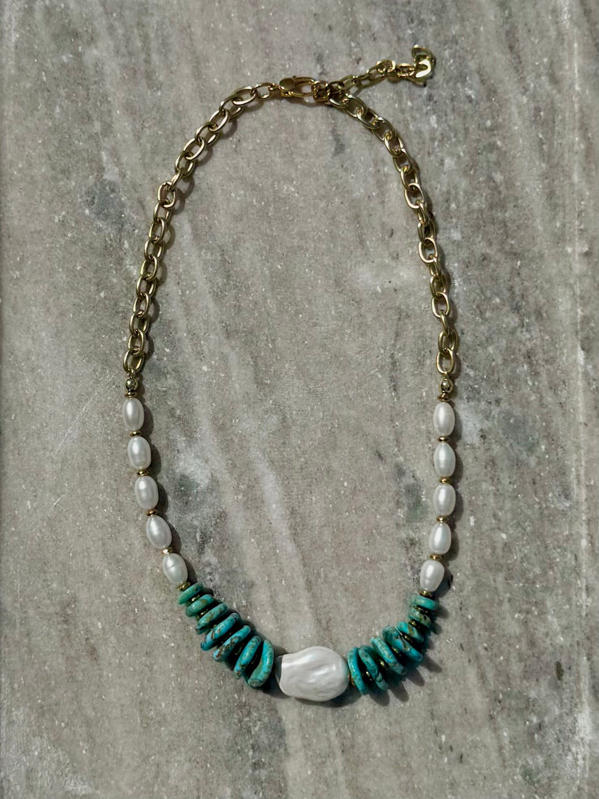 Full view of dyed howlite, freshwater pearl, and gold chain necklace