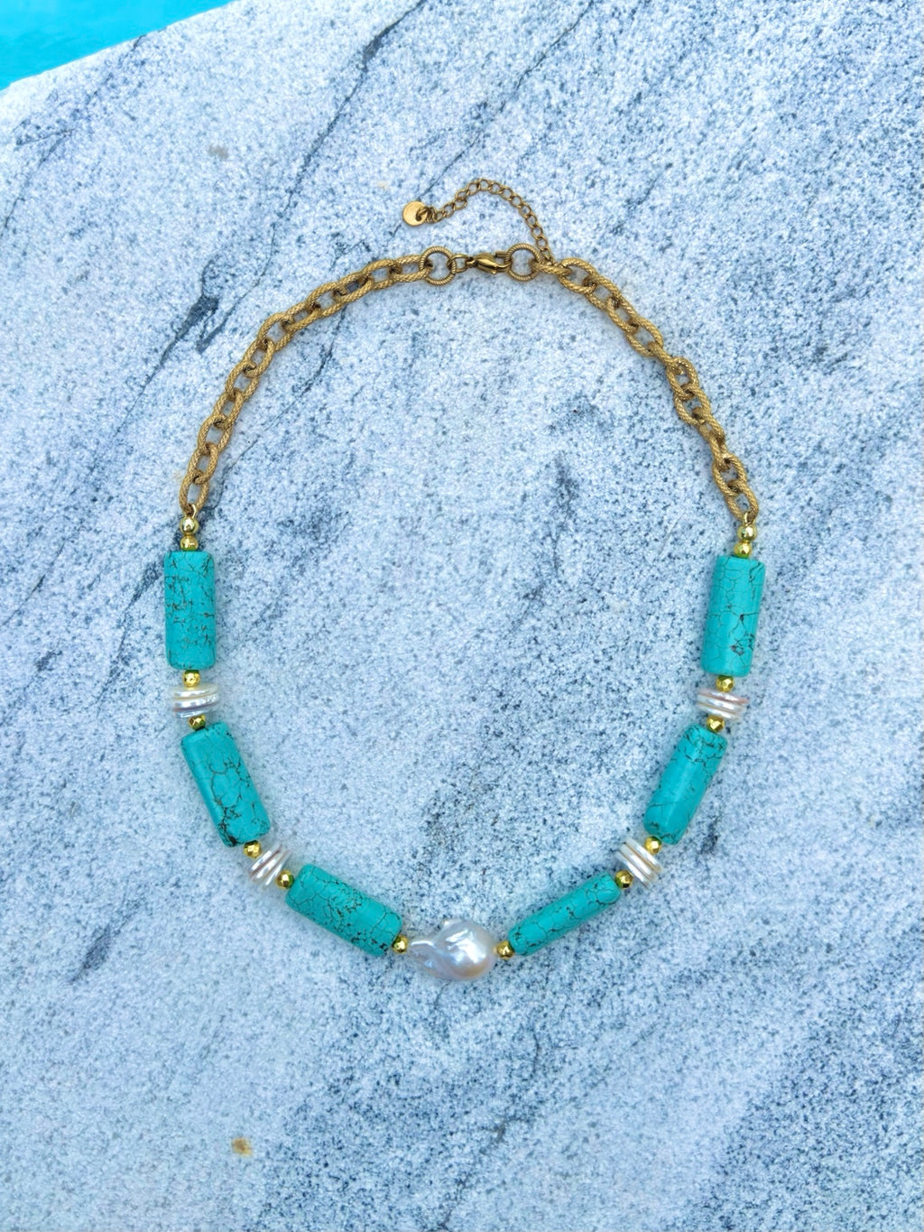 Full view of turquoise barrel and baroque pearl necklace